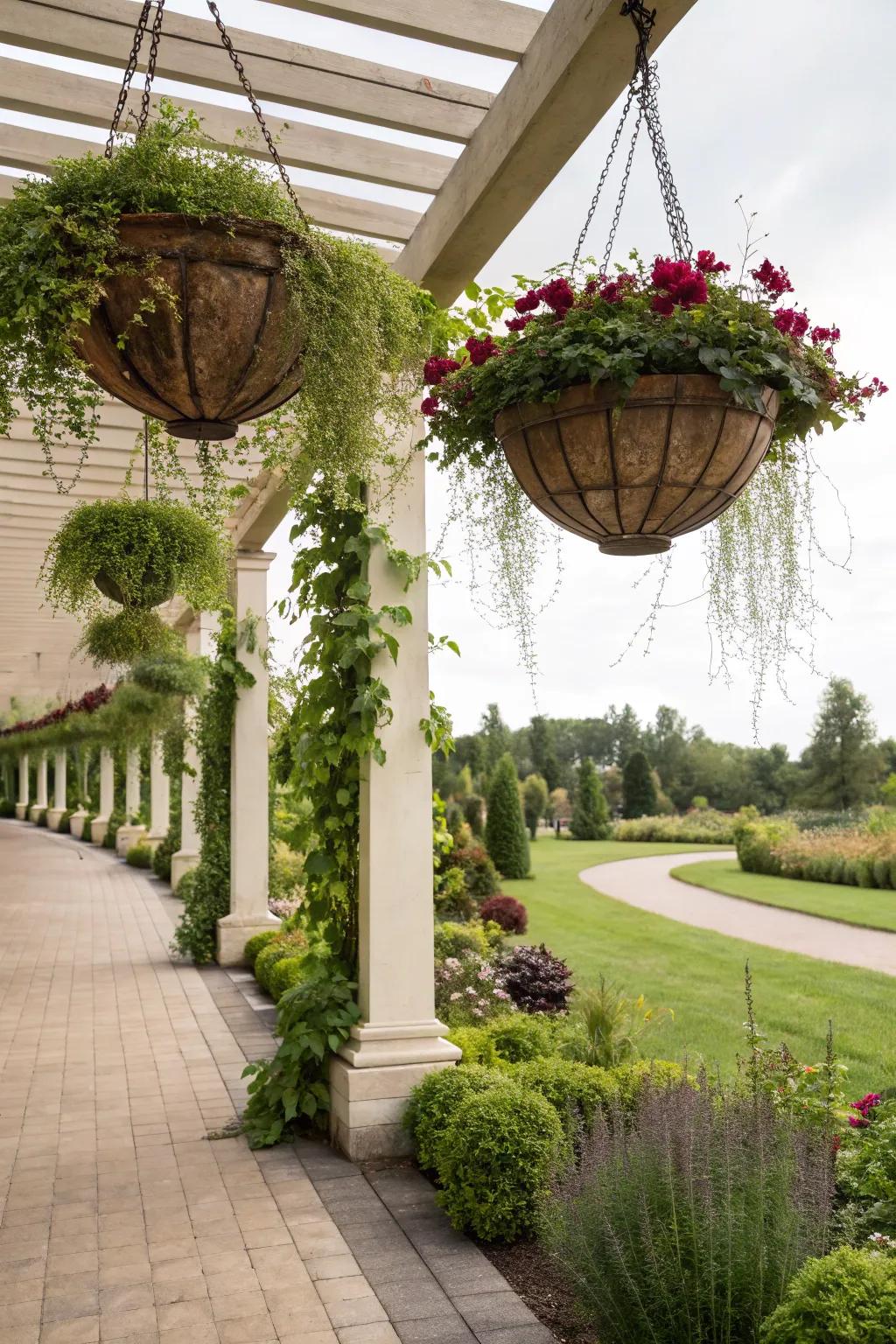 Suspended flora introduce vertical greenery to the pergola.