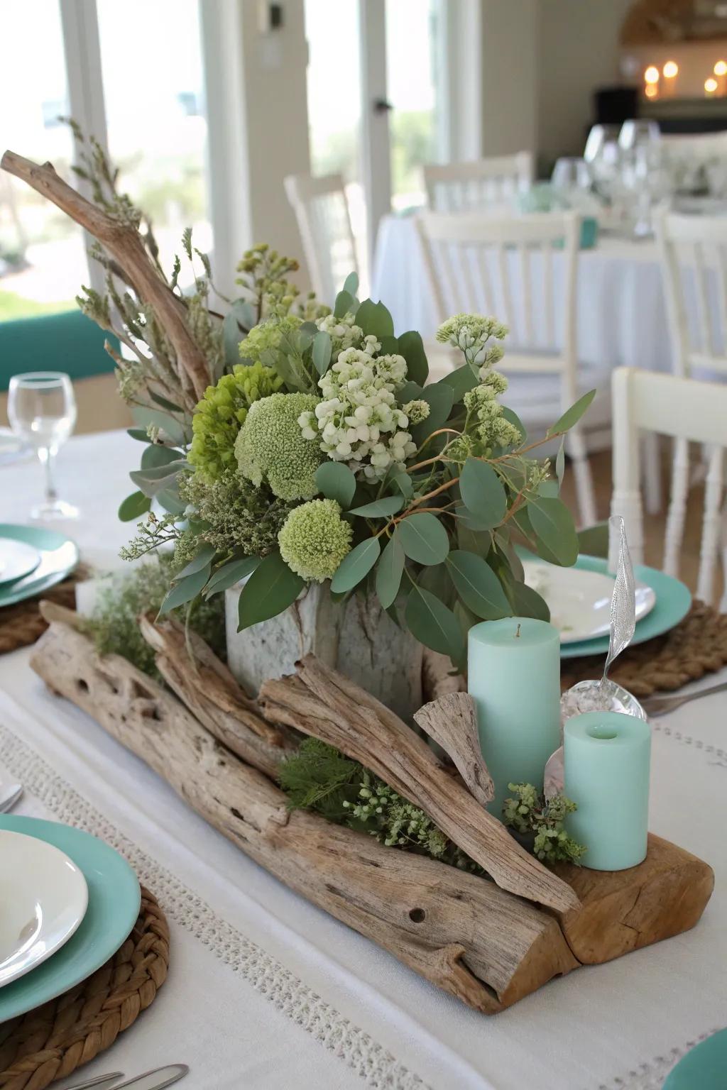 A coastal-inspired centerpiece with driftwood and sage green for a relaxed vibe.