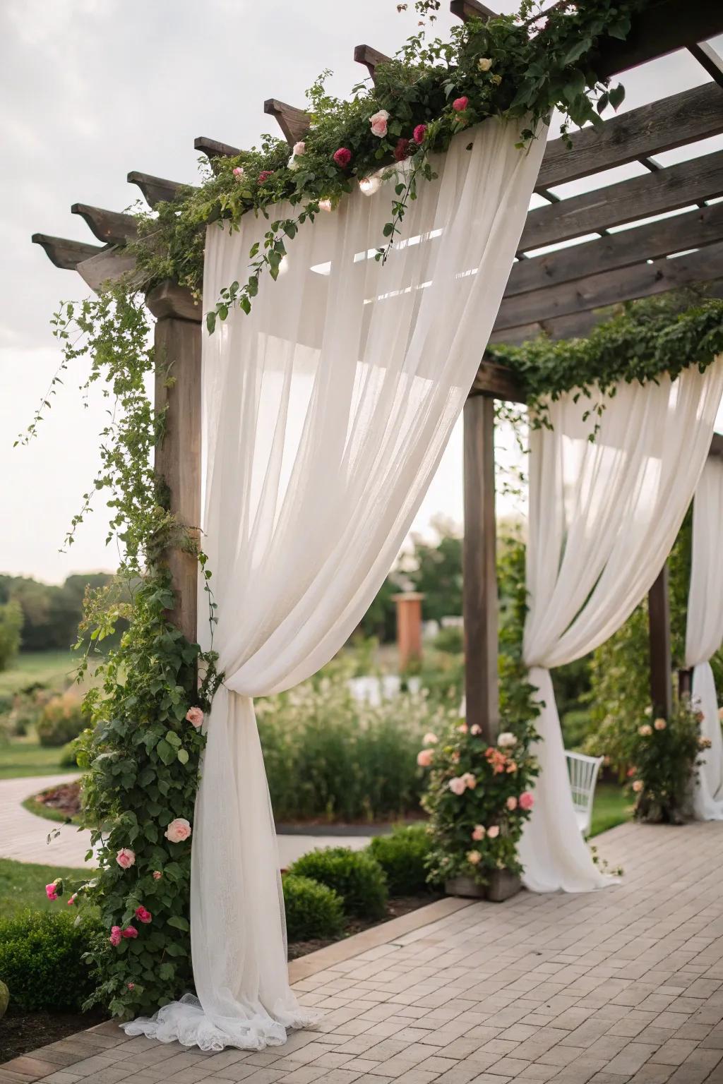 Drapes contribute romance and privacy to the pergola.