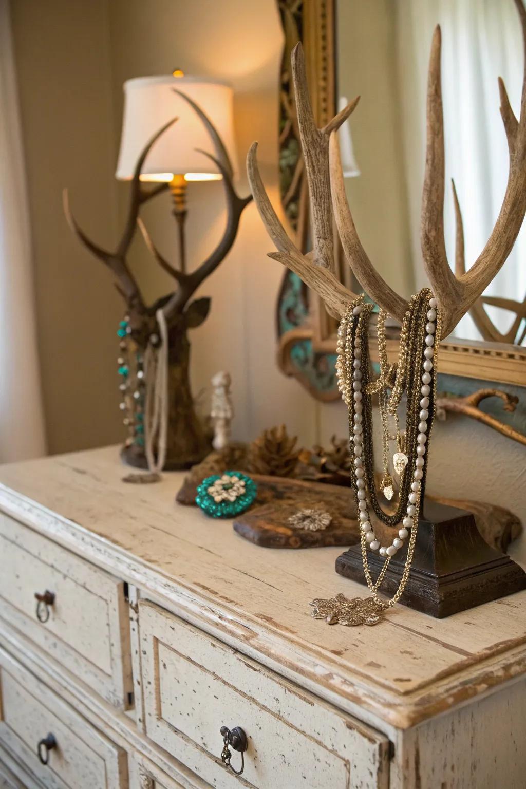 Deer antlers used as a jewelry display add functional style to a vintage dresser.