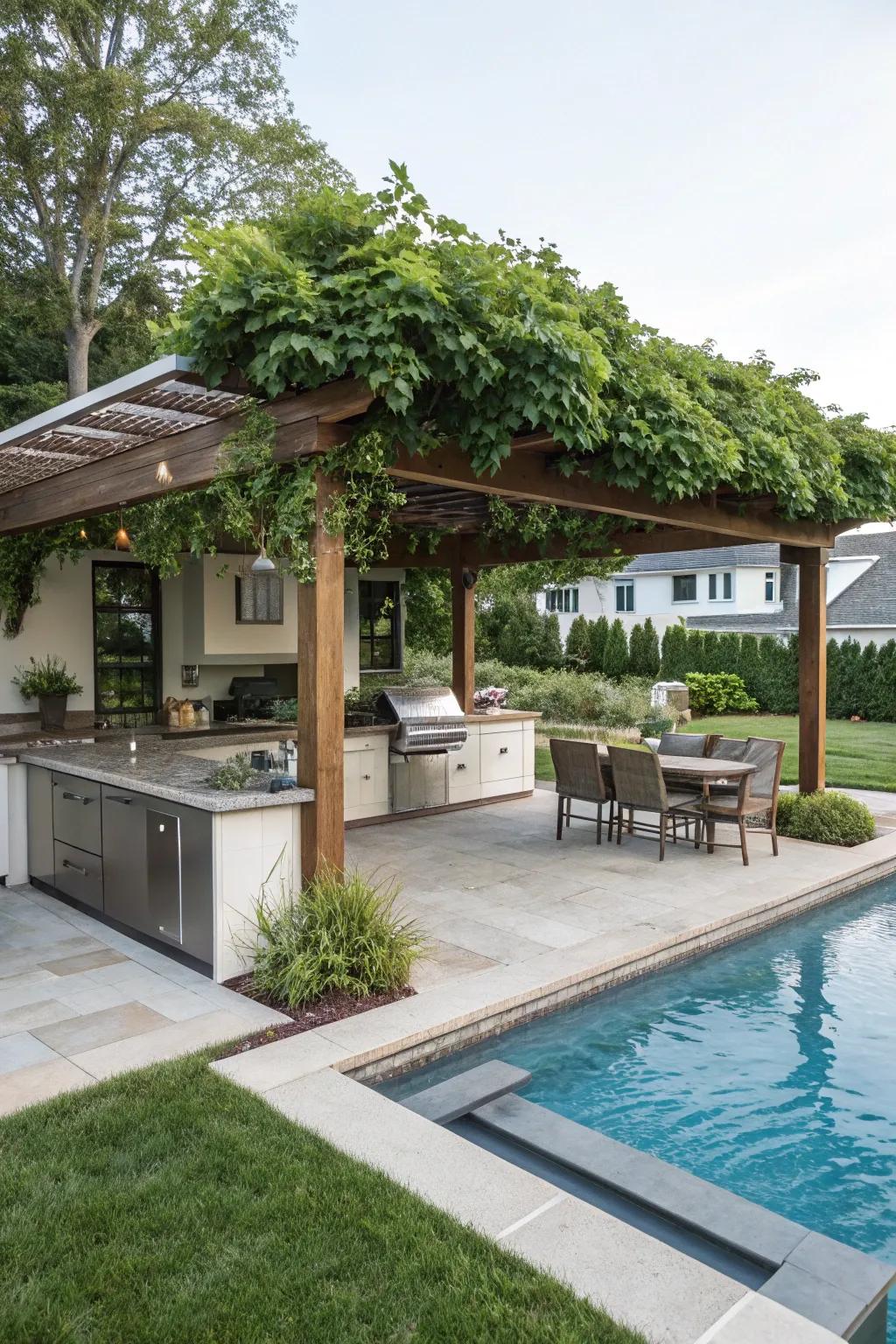 Pergola with outdoor kitchen enhances poolside entertaining.